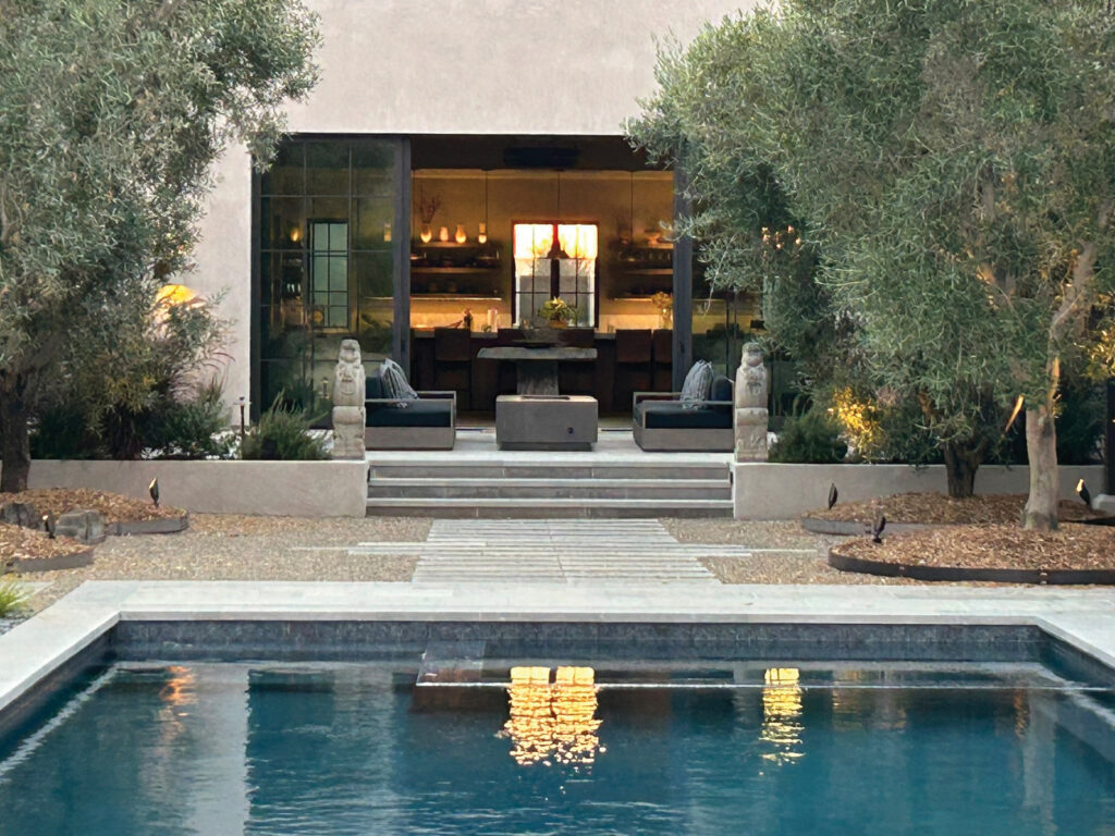 Courtyard with a pool and fire pit
