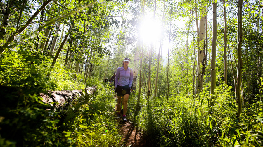 Person running on Cathedral Lake Trail, one of the best hikes near Aspen, CO