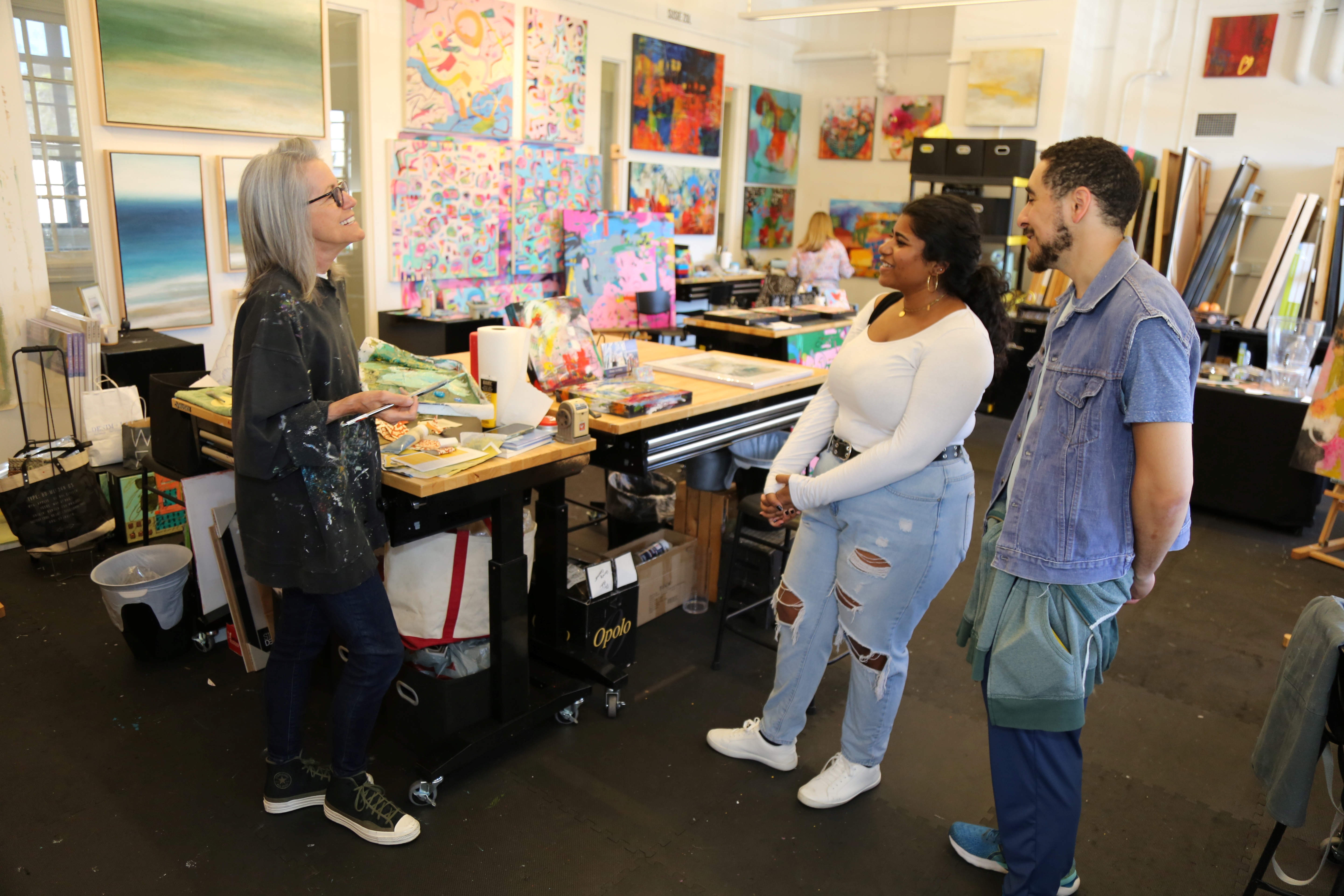 arts-district-liberty-station-guests-chat-with-artist