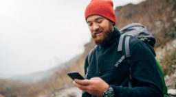 Guy with Phone on Trail