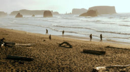 beach towns on the west coast bandon, oregon people walking on beach