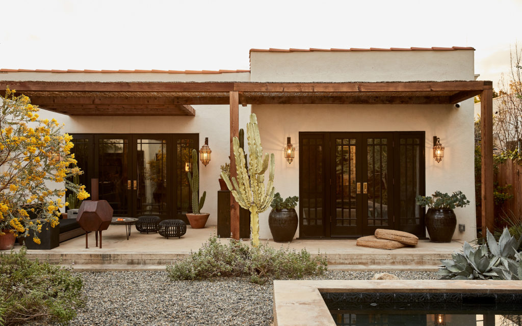 Back of house with cactus and pool view