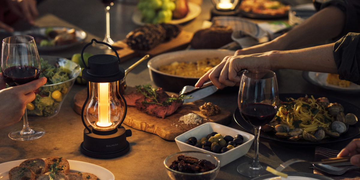 camping lantern illuminating dinner table