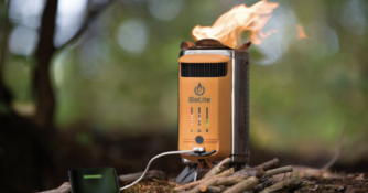 stove on ground produces low flame, attached battery pack charges phone