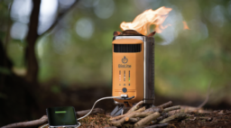 stove on ground produces low flame, attached battery pack charges phone