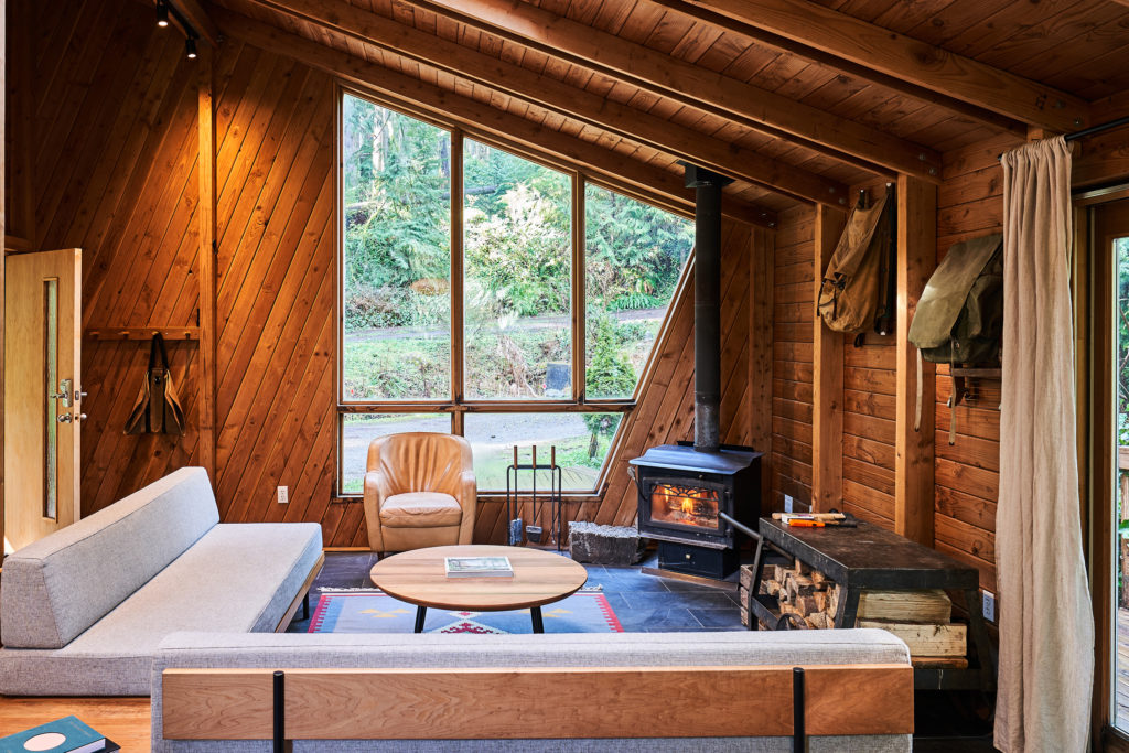 Living room with fireplace at Canyon Creek Cabin