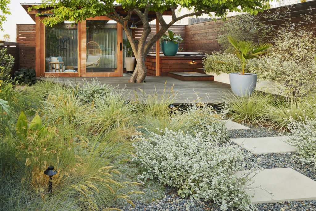 A Cabana that opens out to the hot tub makes full use of a San Francisco Garden