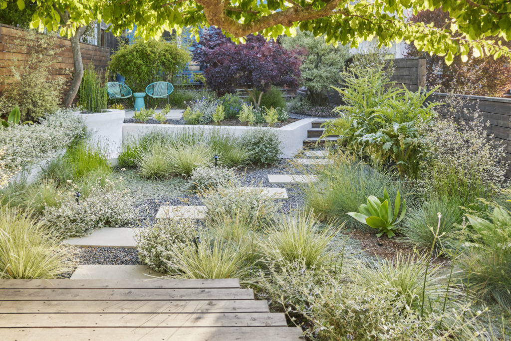 A Cabana that opens out to the hot tub makes full use of a San Francisco Garden