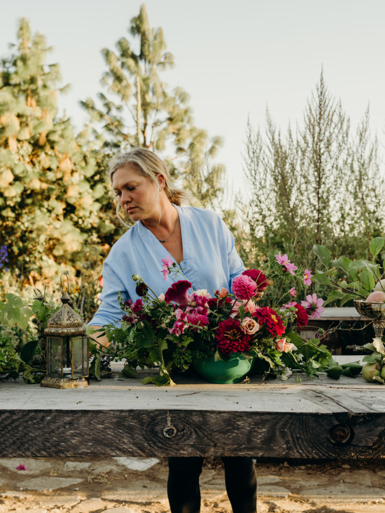 Beth Syphers arranges flowers harvested from her farm