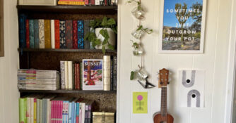 Jars next to bookshelf for plant propagator