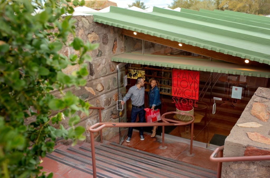 two people exit frank lloyd wright store at taliesin west