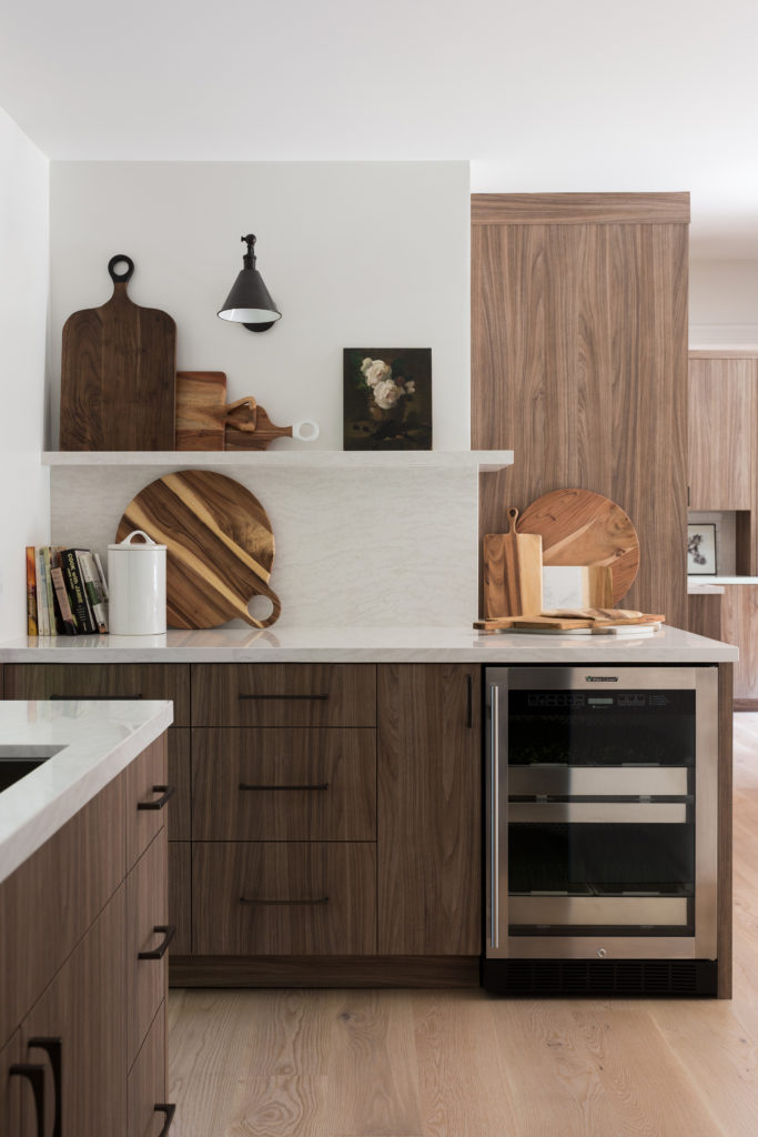 kitchen with floating shelves and wood cabinets