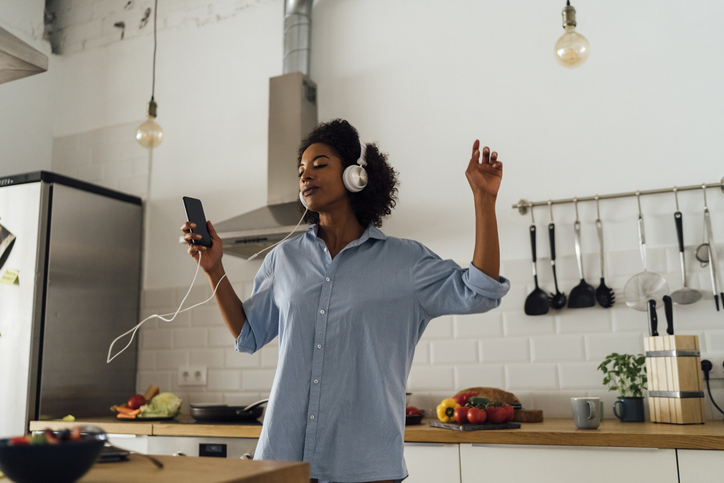 Woman with Smartphone Listening to Music