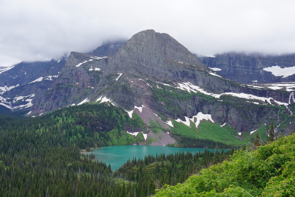 Landscape blue lake green trees mountains