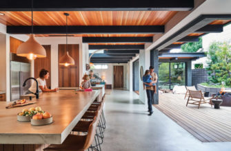 Newport Beach home kitchen with stools, beams, indoor/outdoor space