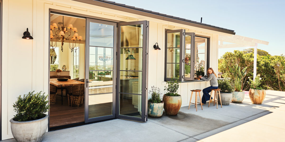 Indoor/outdoor living with bifold doors and passthrough window