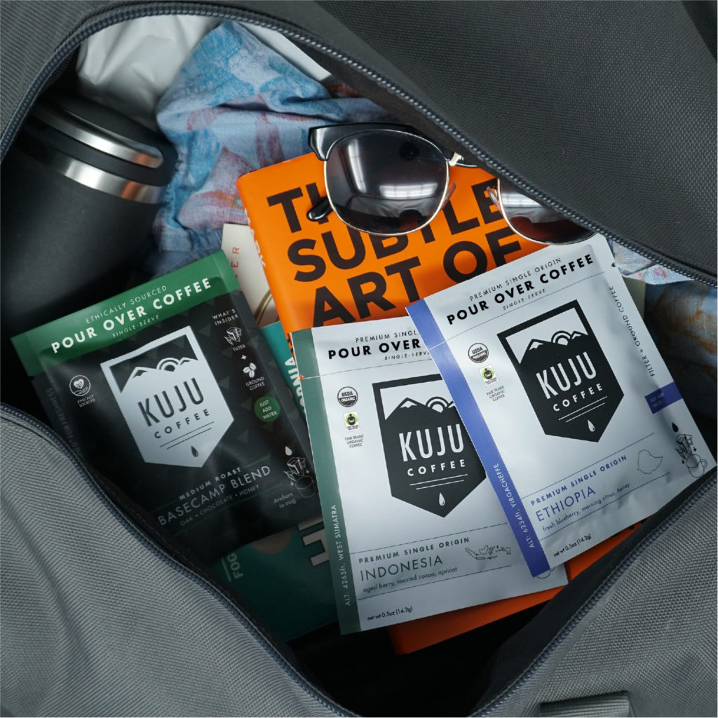 Kuju Coffee pour-over packs in luggage