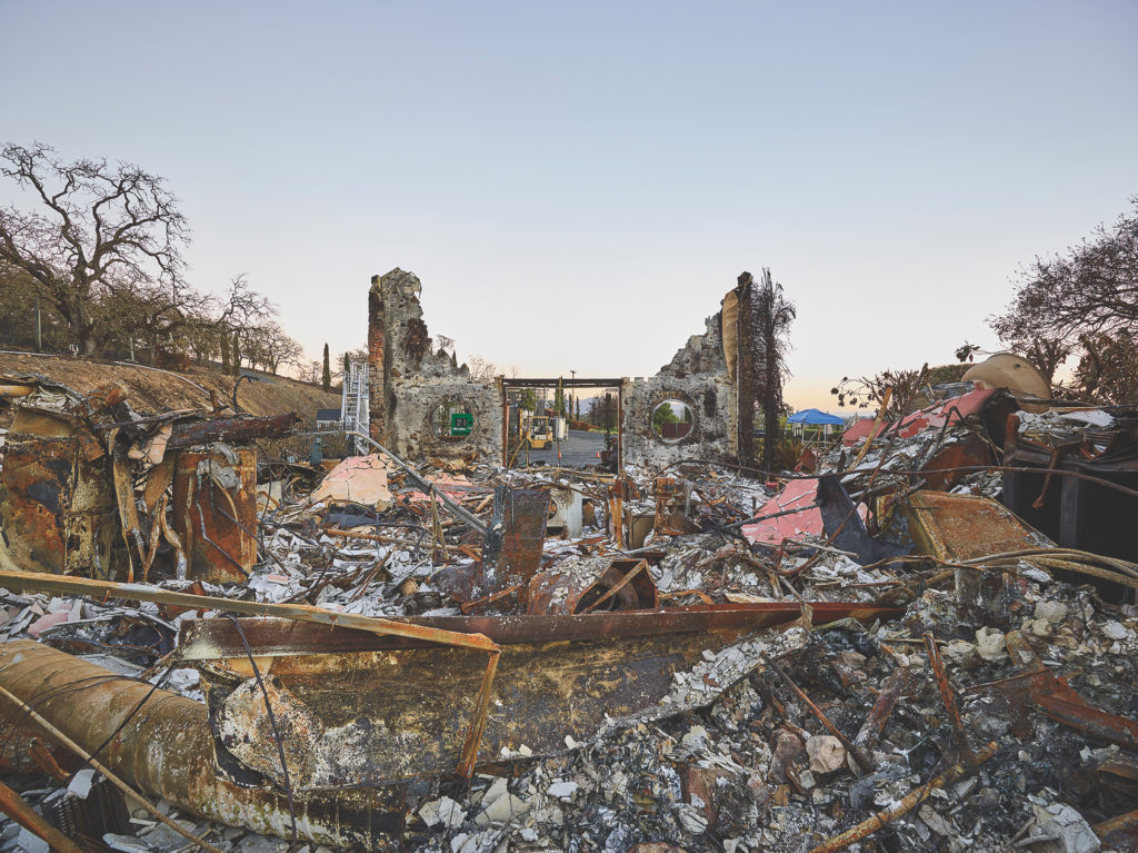 The ruins and rubble of Signorello Estate Winery after the 2017 fires, photographed during sunset