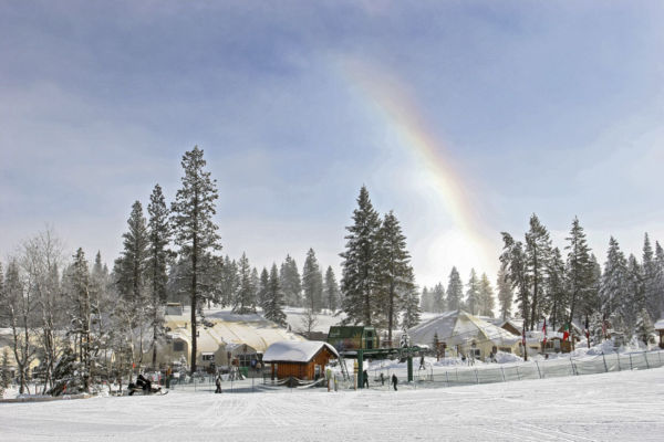 The base at Tamarack Resort with sports and cafe domes and a snow rainbow