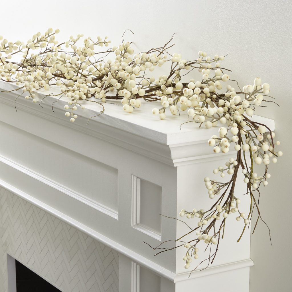 white berry garland on mantle