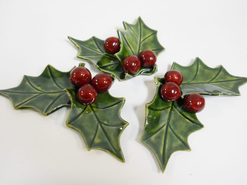 trio of ceramic holly leaves and berries