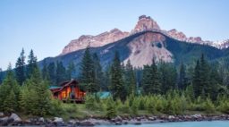 Cathedral Mountain Lodge's cozy cabins set against the mountains of B.C.