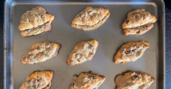 A baking sheet full of the crookie, a hybrid between croissants and chocolate chip cookies.
