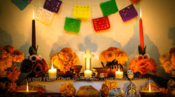 Traditional mexican Day of the dead altar with cempasuchil flowers, bread 
