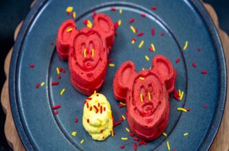 Two red waffles in the shape of Mickey Mouse