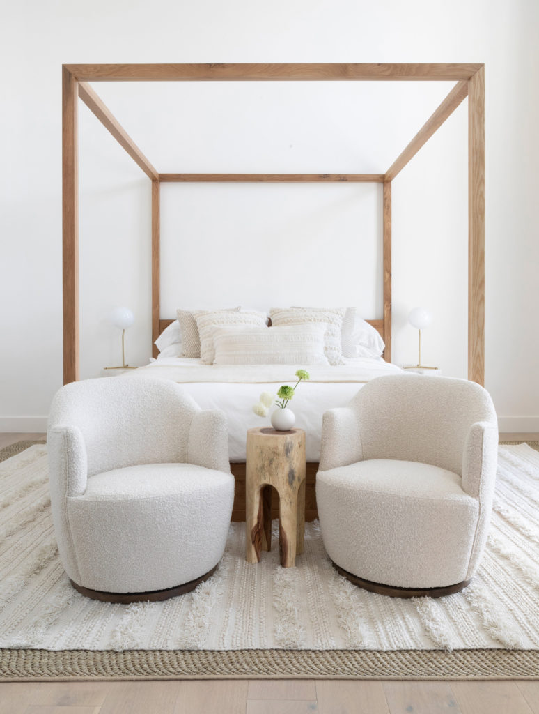 White swivel chairs in a bedroom by Lulu and Georgia