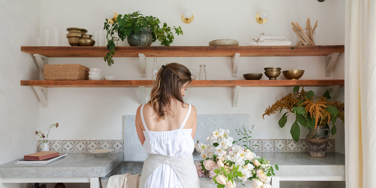 Teressa Johnson Floral Studio white flowers kitchen sink and floating shelves