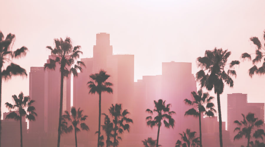 Downtown Los Angeles skyline with pink glow to represent ghost tours in Los Angeles