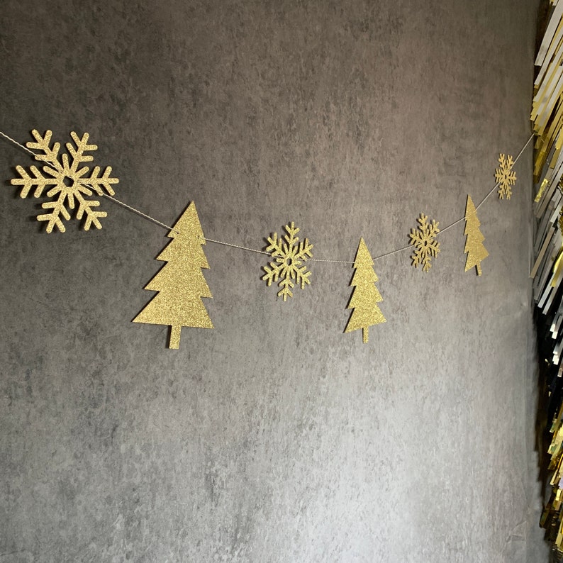 garland with gold christmas trees and snowflakes