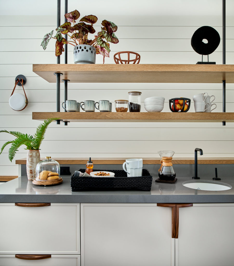 Kitchenette with floating shelves and grey countertop at Park City home