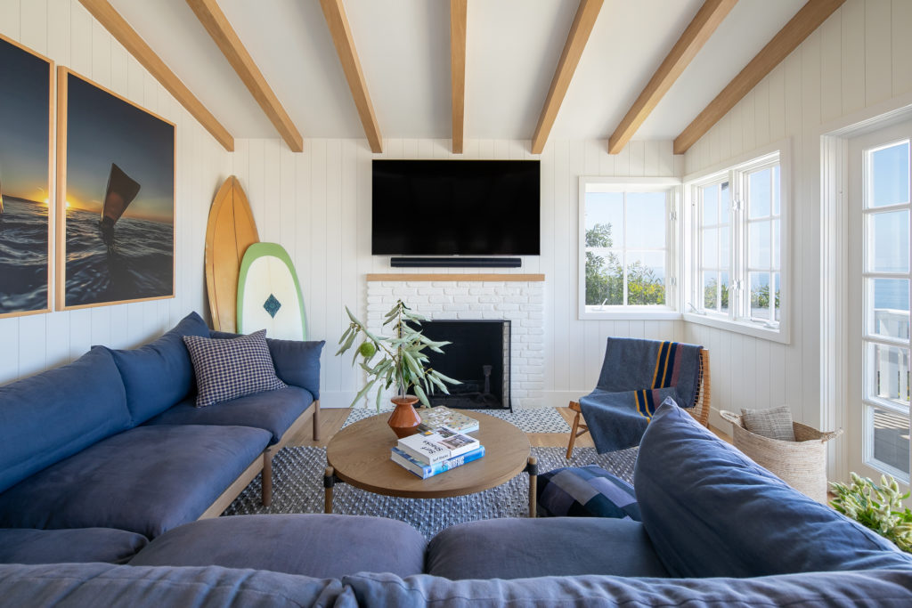 Raili Clasen design Laguna Beach living room blue sectional surf boards