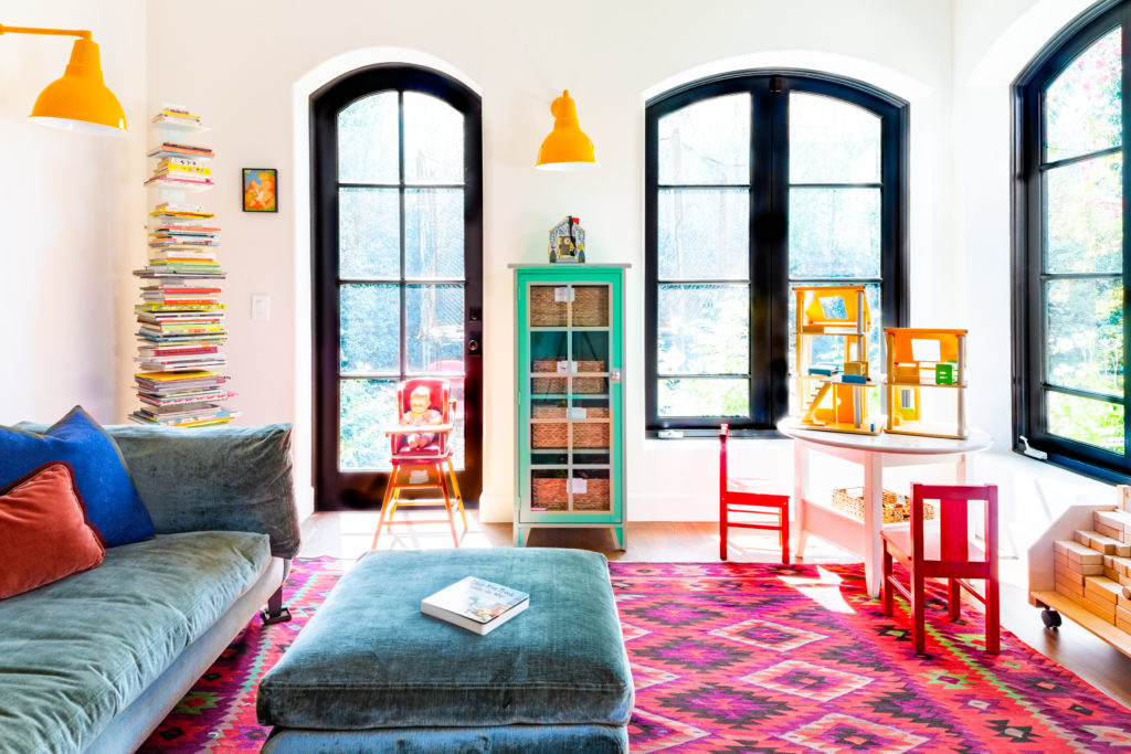 playroom Spanish remodel pink rug yellow sconces
