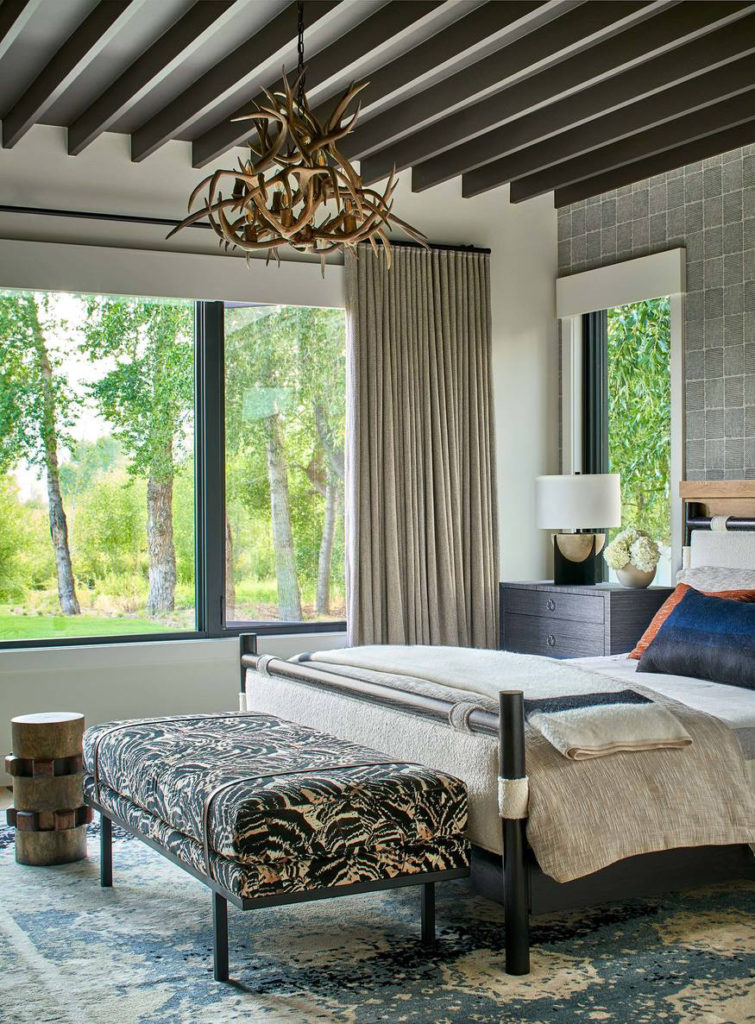 Bedroom in Park City with antler chandelier