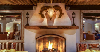 Fireplace and Cow Skull at Inn at Loretto