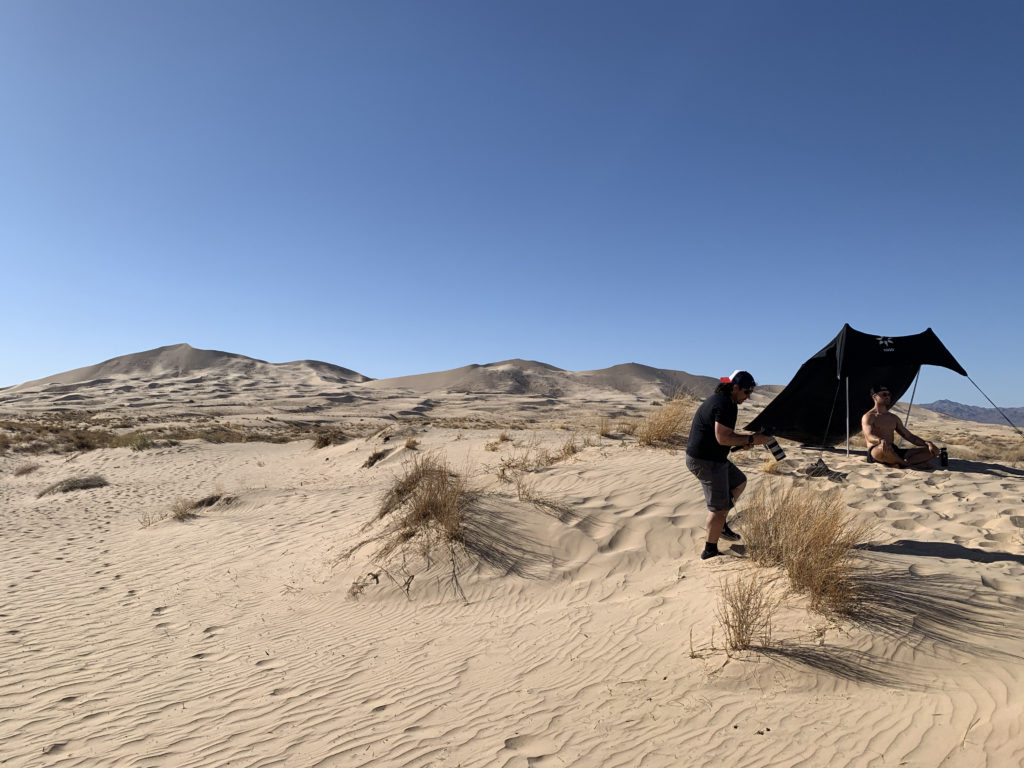 Athlete and photographer at Kelso Dunes Mojave National Preserve