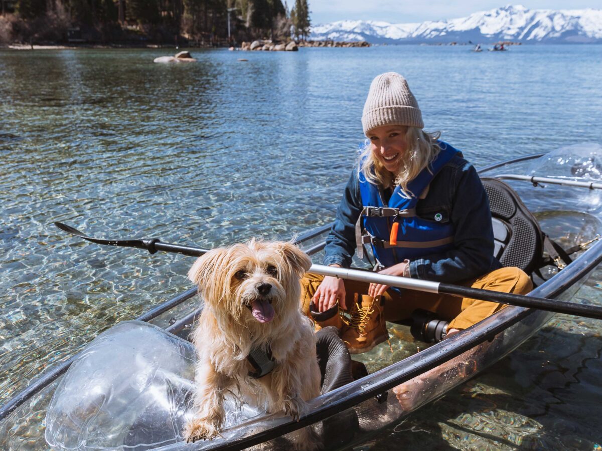 Woman and Dog in a Clear Kayak