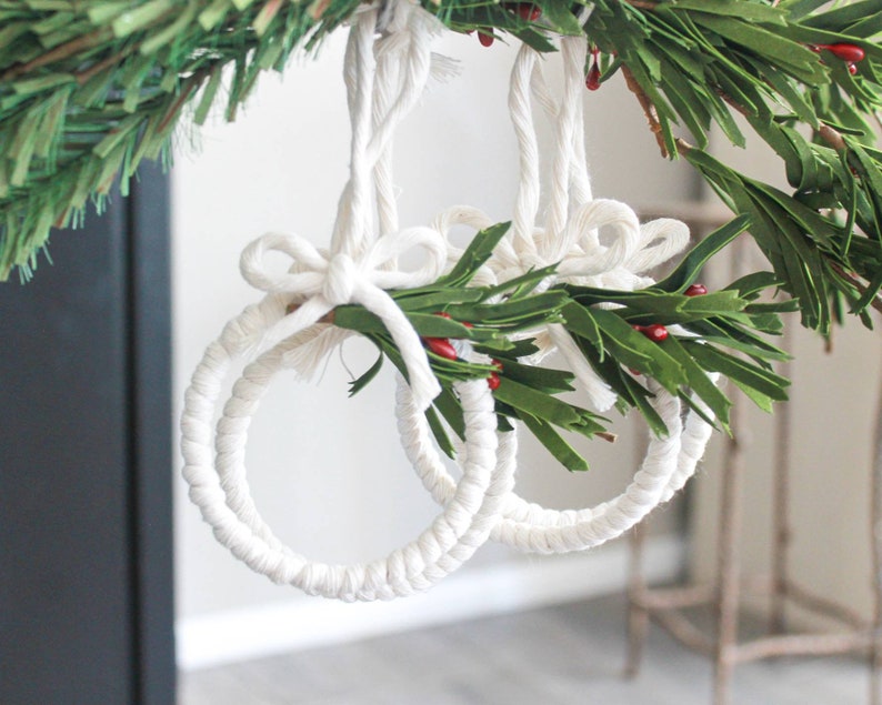macrame white hoops hanging from tree