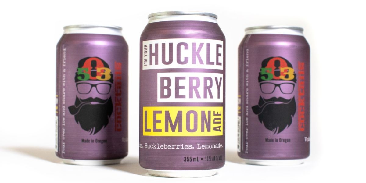 three cans of 503 Distilling i'm your huckleberry lemonade with two facing backwards and one facing forward on a white background.