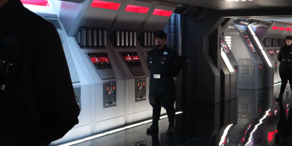 First Order officers escort captured members of the Resistance to their holding cells.