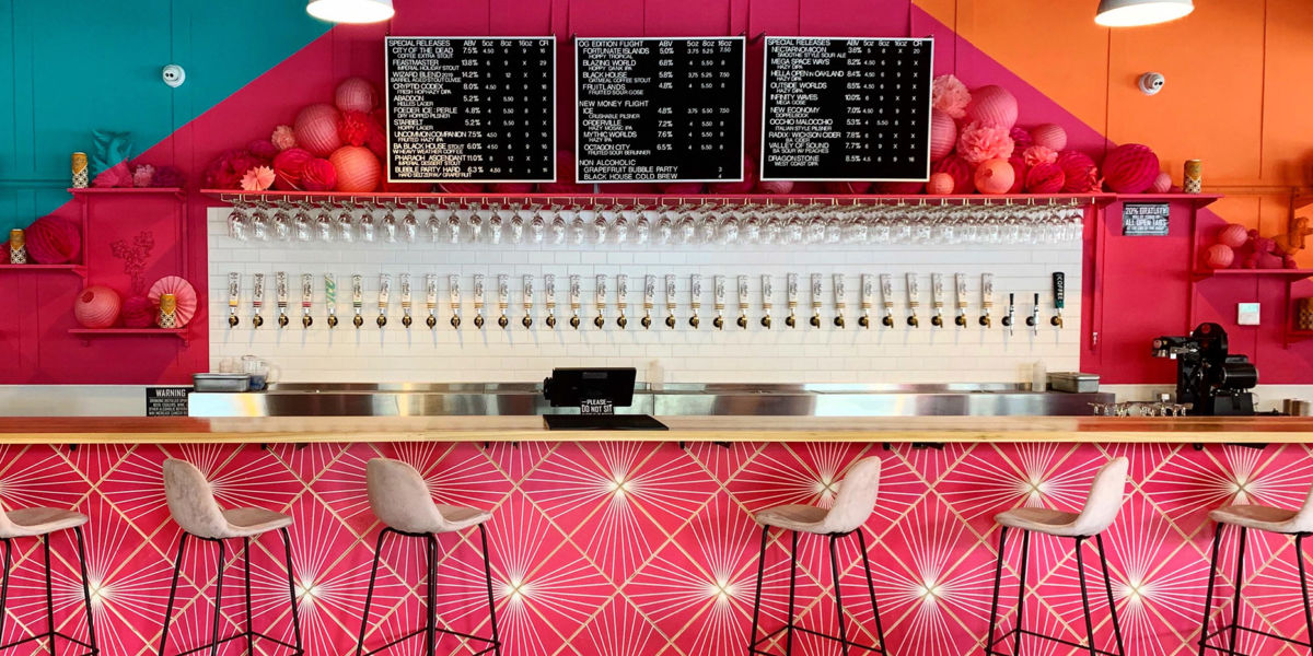 Brightly colored bar with taps at Modern Times Oakland