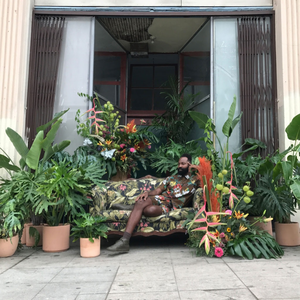 Maurice Harris on a Floral Couch