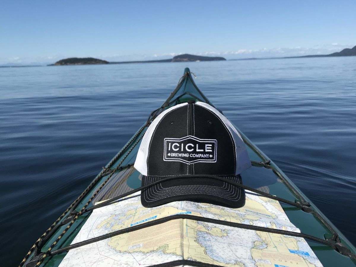 View of the water and islands from the tip of a kayak.
