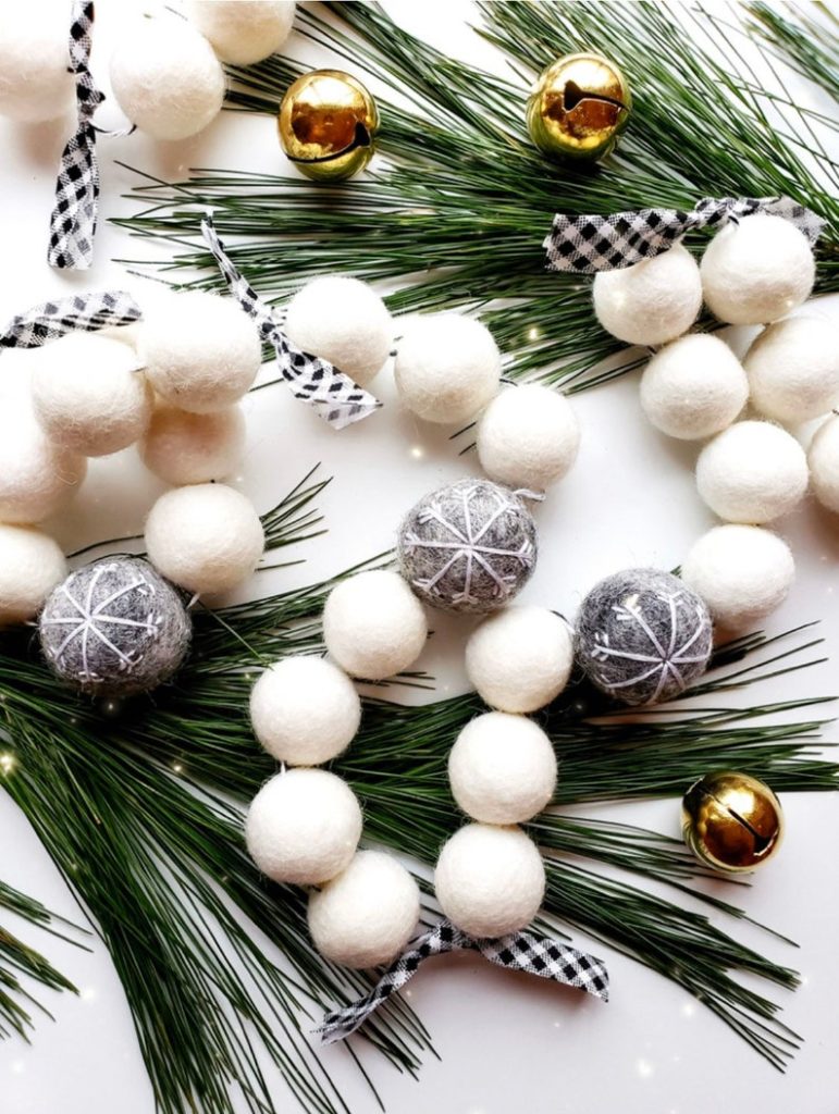 string of white balls grey balls with snowflakes and plaid ribbons