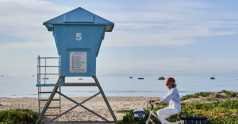 Christine Lennon with a Lifeguard Tower