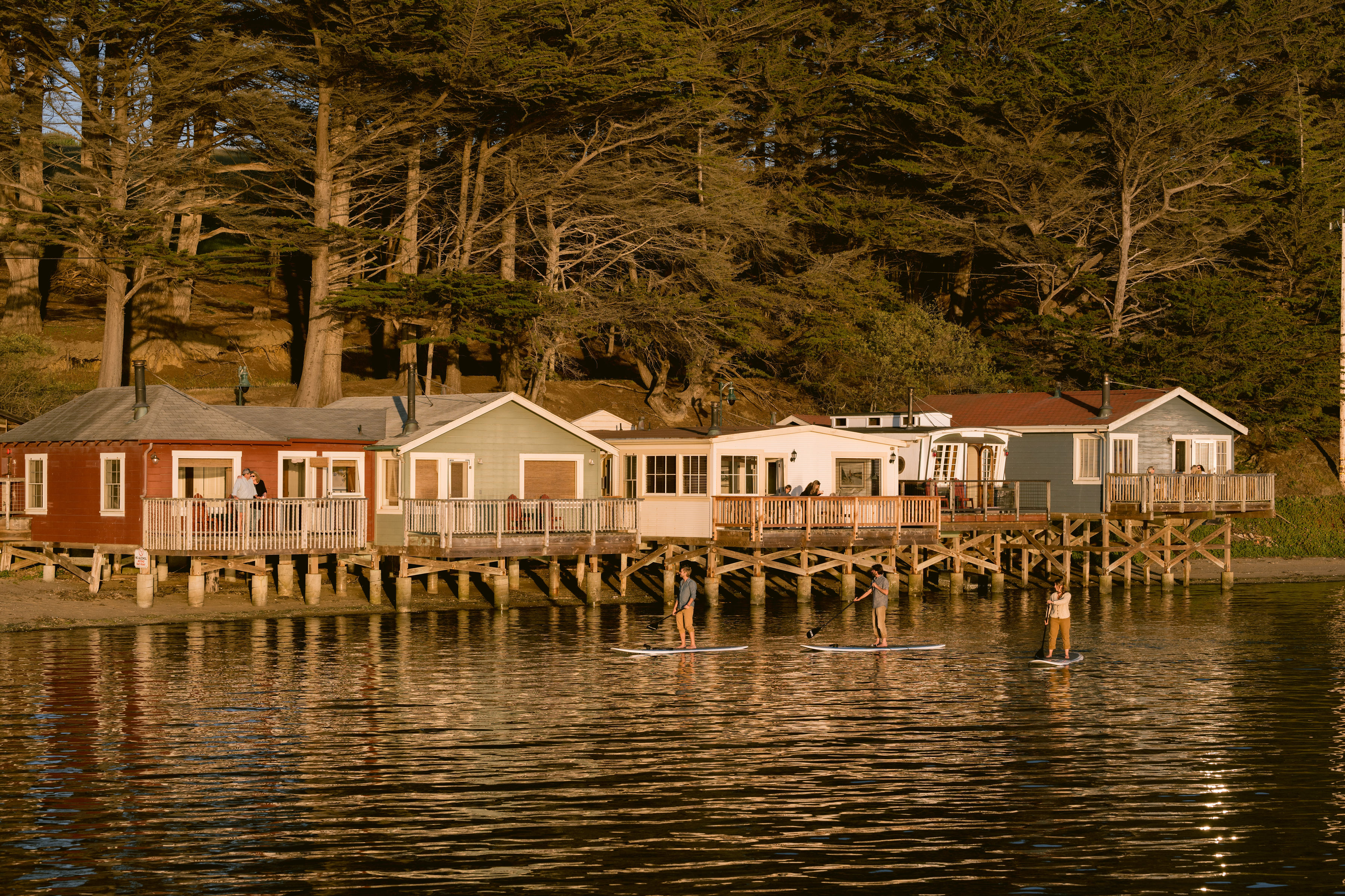 paddleboarding in front of cottages credit Kristen Loken.jpg