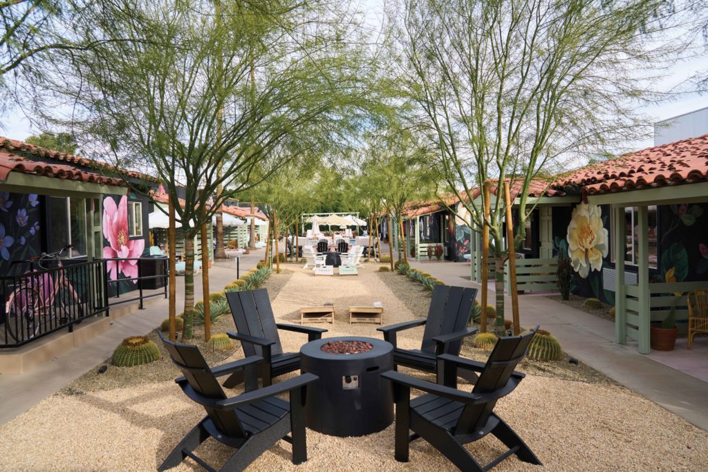 Fire Pit and Adirondack Chairs at Fleur Noire Hotel